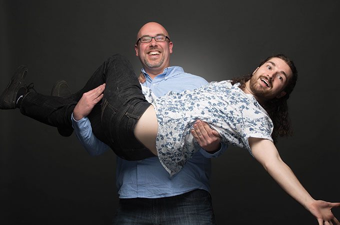 Sublime Media Group puppeteers, David Hosay holding James Kemp like a baby