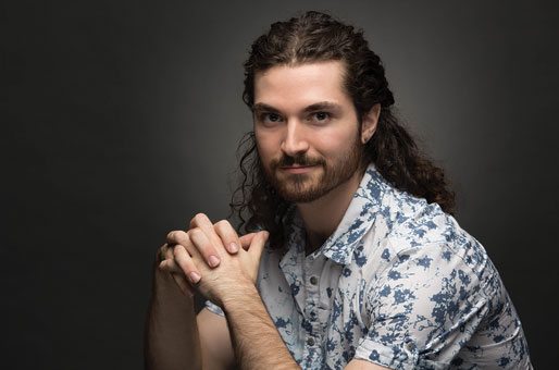 Sublime Media Group puppeteer and puppet builder, James Kemp, posing with his hands closed