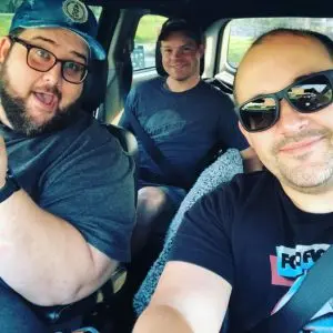 Members of the Sublime Media Group video live stream team posing for a selfie in a van on their way to live stream Shirt Lab 2021