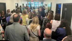 Sublime Media Group's chamber after hours crowd gathered in the main hallways of their facility listening to the owner's speak