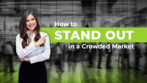 caucasian female in business attire pointing at text that says stand out promoting a content marketing blog post