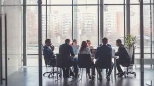 branding checklist team meeting in an office with business people in suits